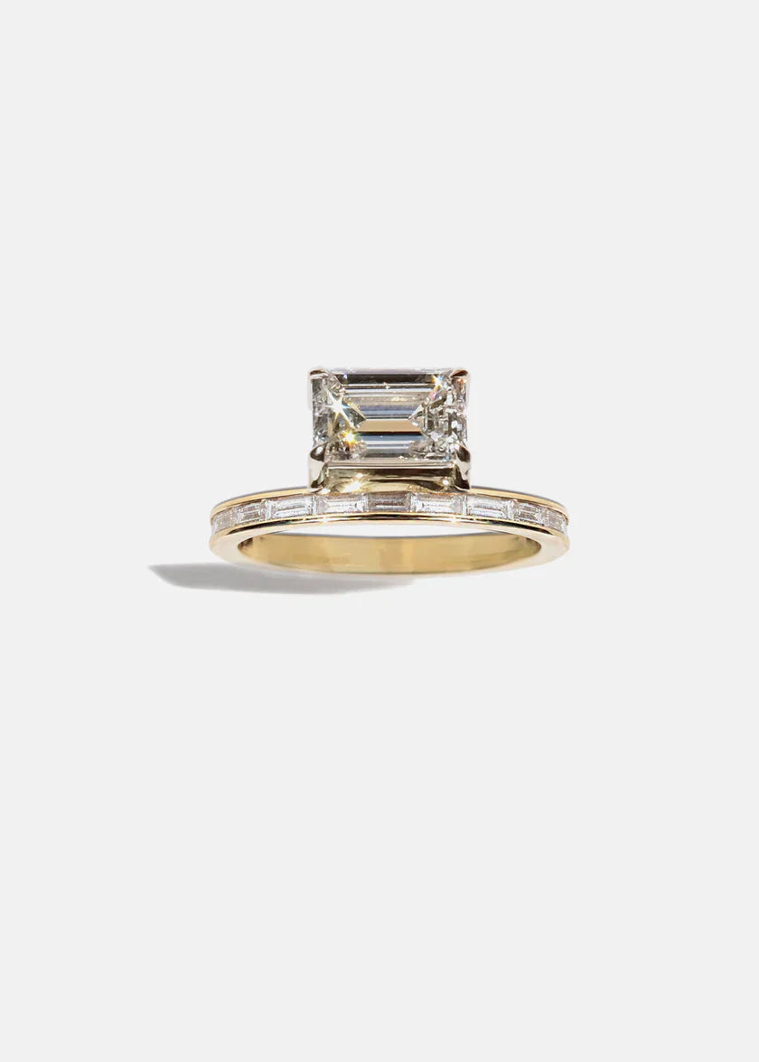 Front view of 2.50ct emerald floating E VS CVD diamond pavé engagement ring with wedding band and elegant bridal styling
