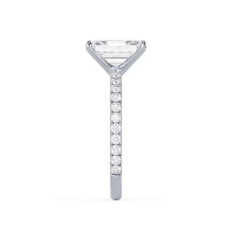 Side profile of an emerald cut lab grown diamond pave engagement ring showing slim elegant band structure
