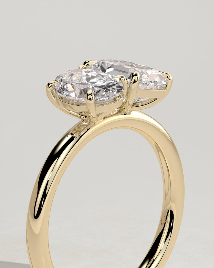 Emerald cut and oval diamond ring