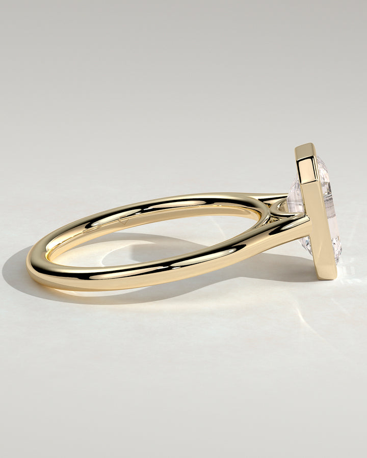 Emerald cut bezel solitaire