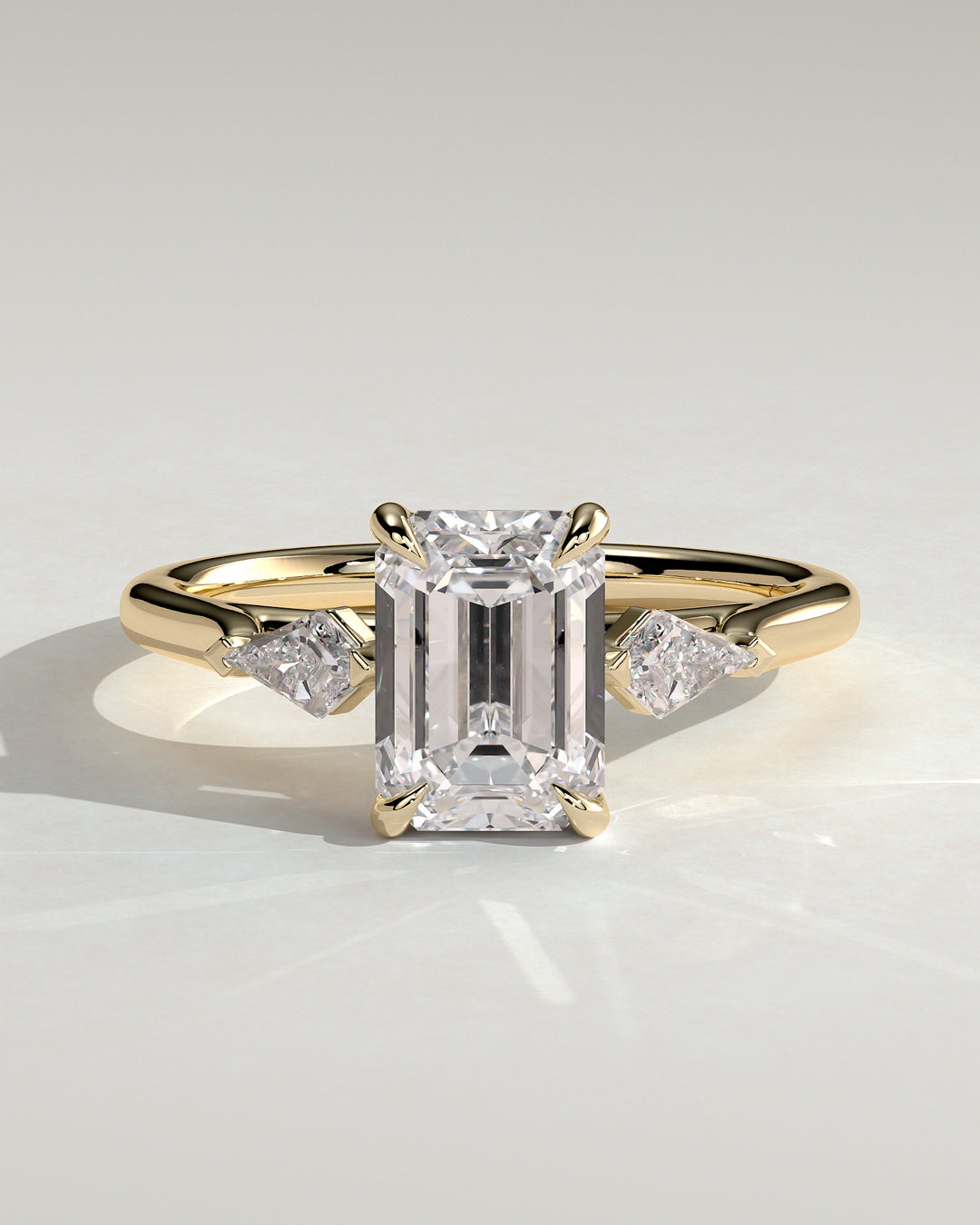Emerald trilogy engagement ring
