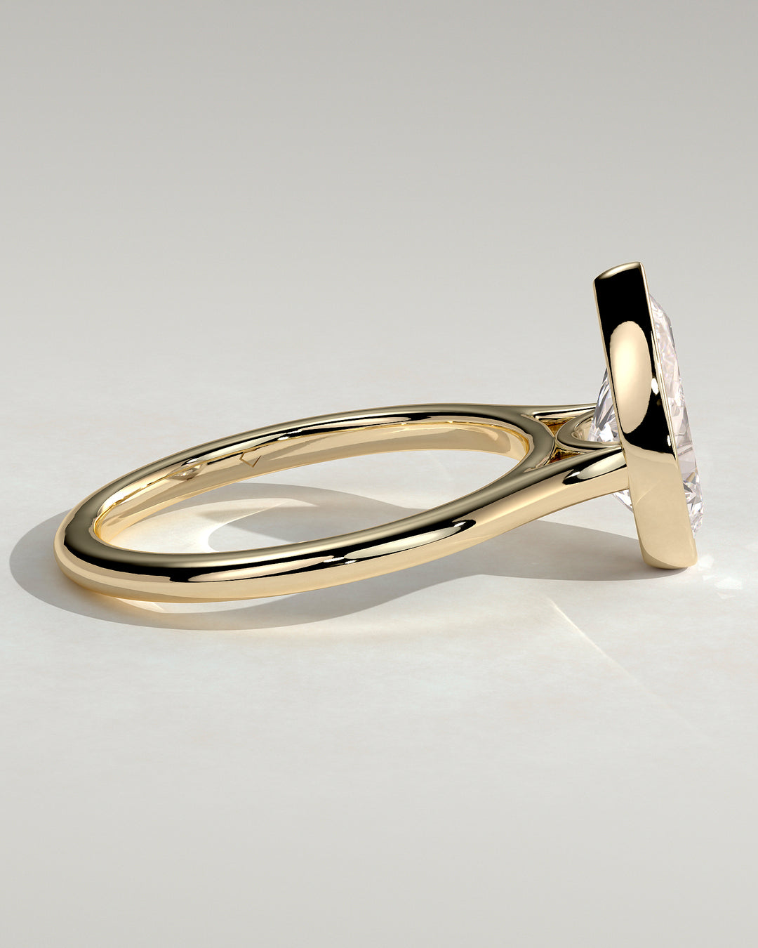 Floating pear bezel ring