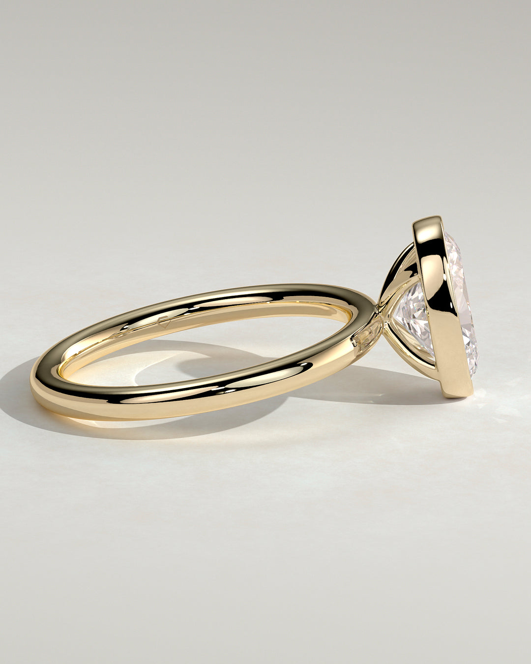 Full bezel oval diamond ring