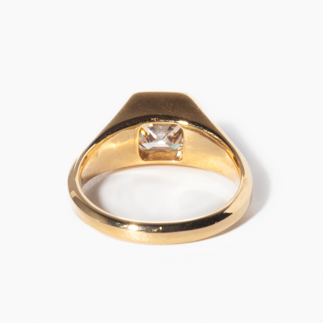 Geometric Asscher cut lab grown diamond signet engagement ring set on polished gold band with modern structure