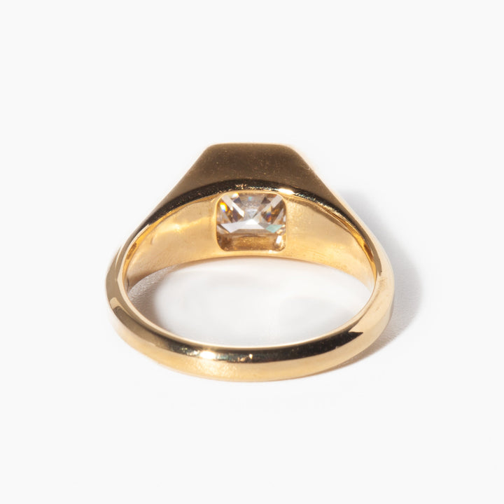 Geometric Asscher cut lab grown diamond signet engagement ring set on polished gold band with modern structure