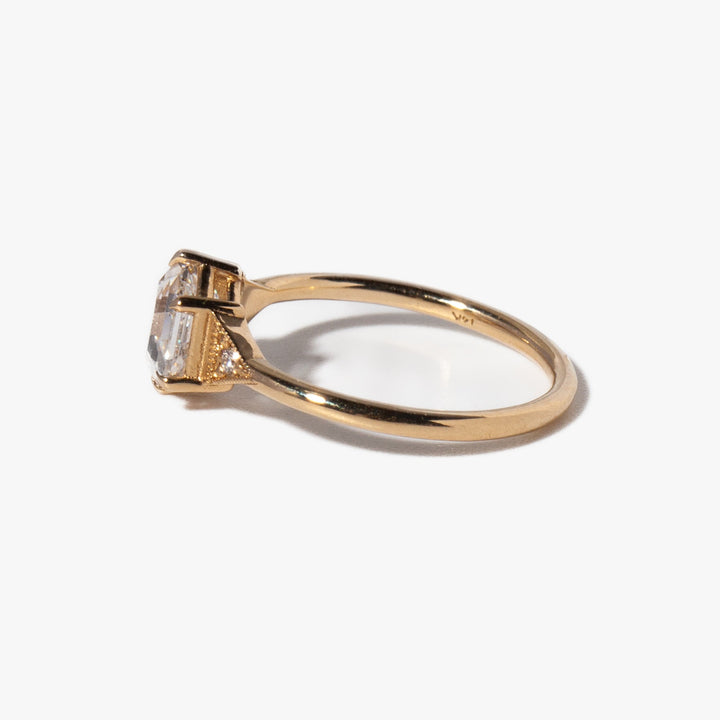 Close-up of hexagon cut lab grown diamond engagement ring showing sharp geometric edges and vintage art deco styling