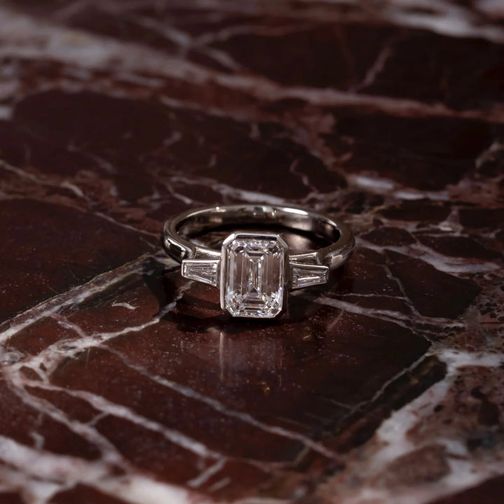 1.50CT Bezel Set Emerald Cut Lab Grown Diamond Three Stone Engagement Rings