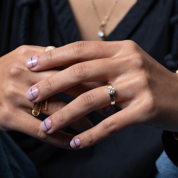 Contemporary engagement ring featuring round lab grown diamond cigar band design with bold minimalist structure and modern finish