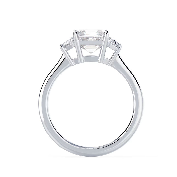 Close-up of a 1.5 carat Asscher cut lab grown diamond three stone engagement ring showcasing step-cut facets