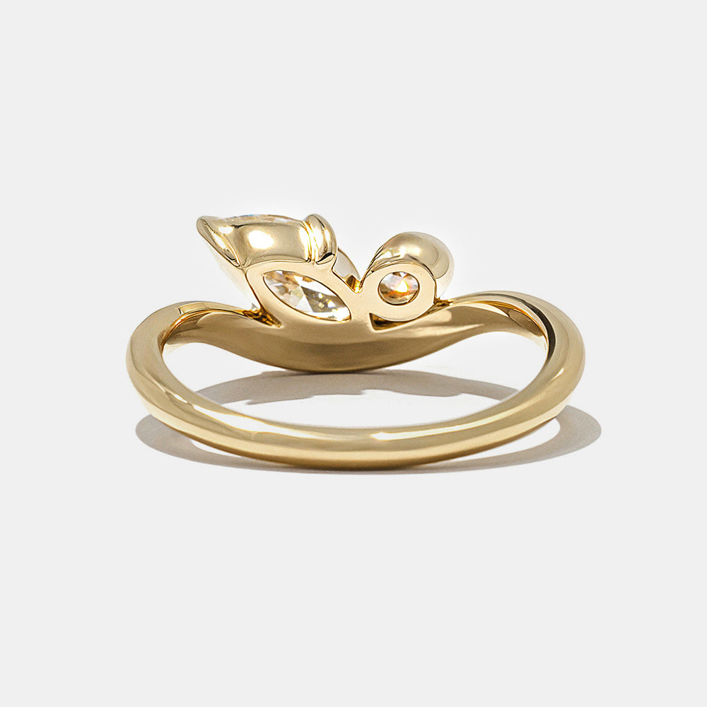 0.7 carat marquise and oval lab diamond Toi Et Moi engagement ring in polished gold bezel setting minimalist style