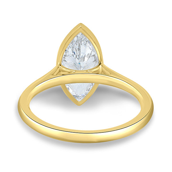 Close-up of marquise cut lab grown diamond cathedral engagement ring highlighting the secure bezel setting and elongated shape