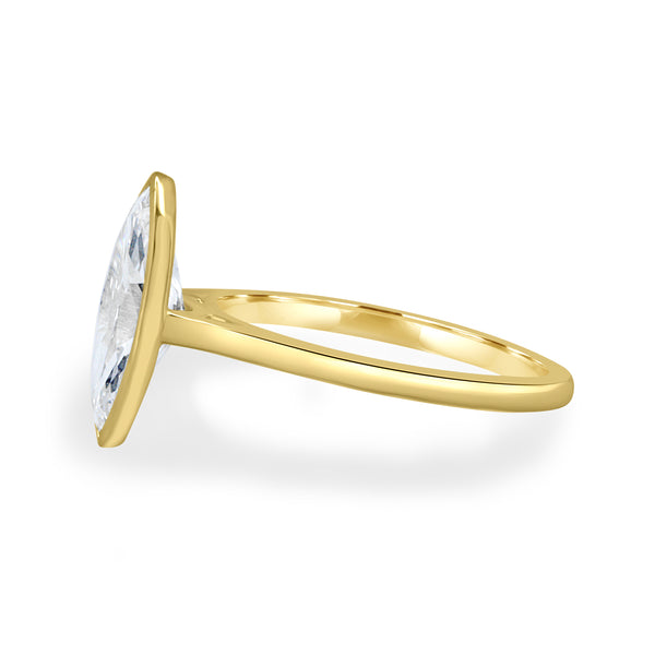 Side profile of bezel set marquise lab grown diamond engagement ring showing cathedral arches and elevated structure