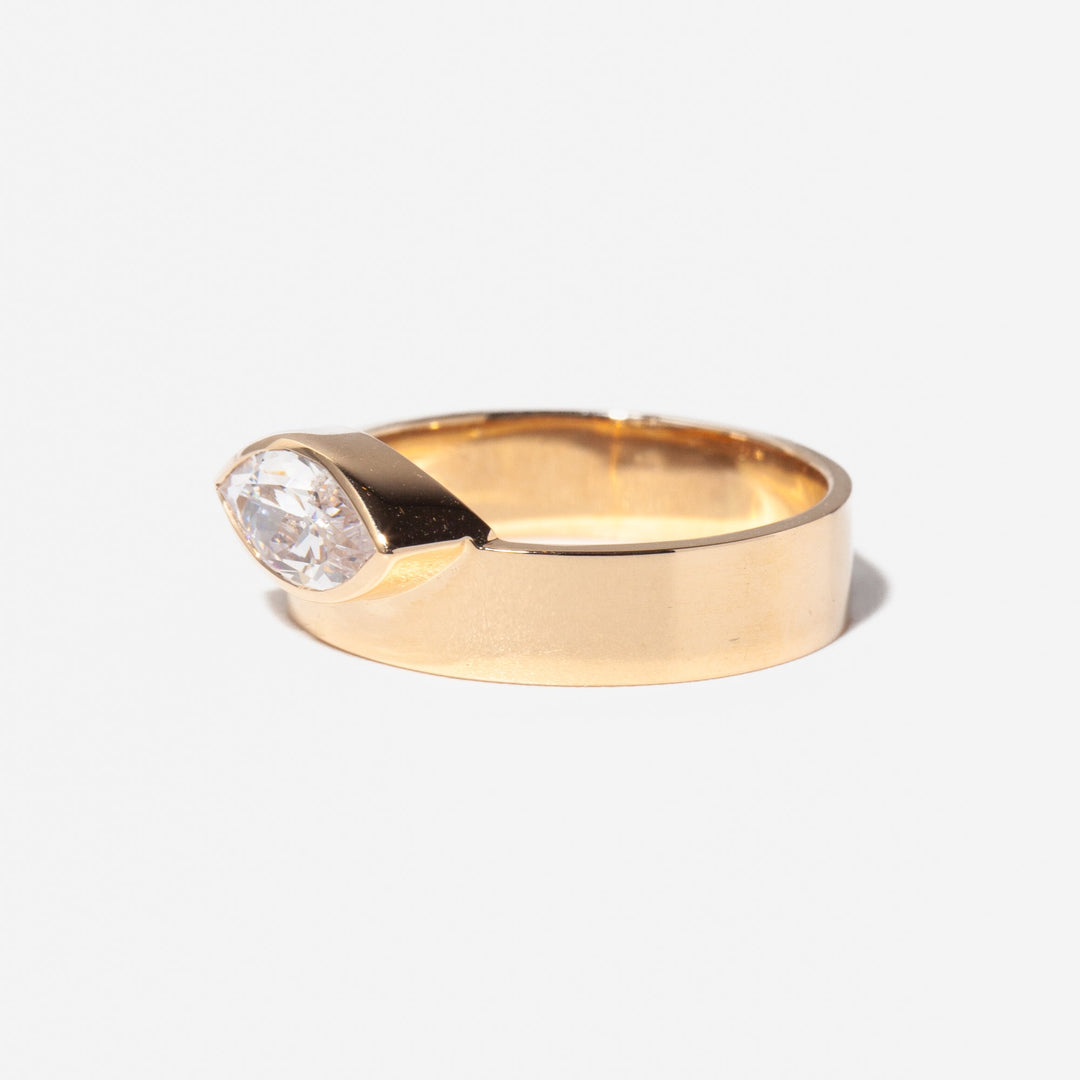 Side profile of east west marquise cut lab grown diamond monolith engagement ring with sleek architectural structure