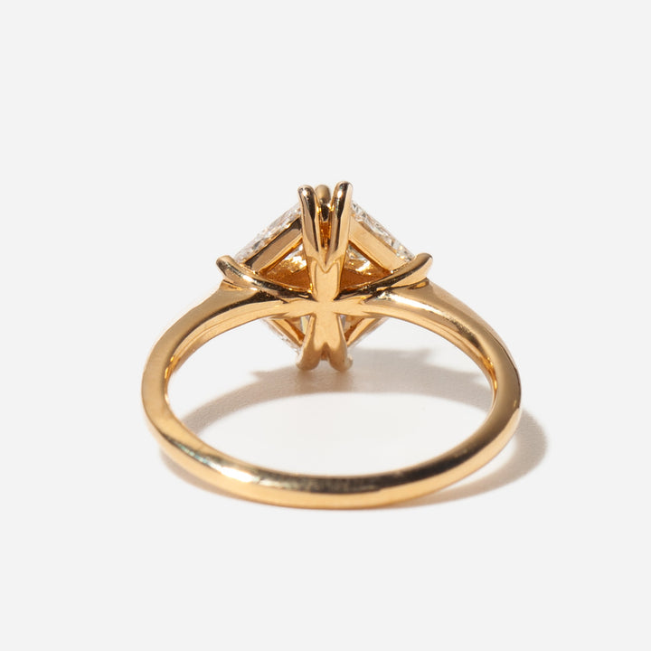 Modern artistic engagement ring featuring half moon lab diamond and teal sapphire gemstone combination