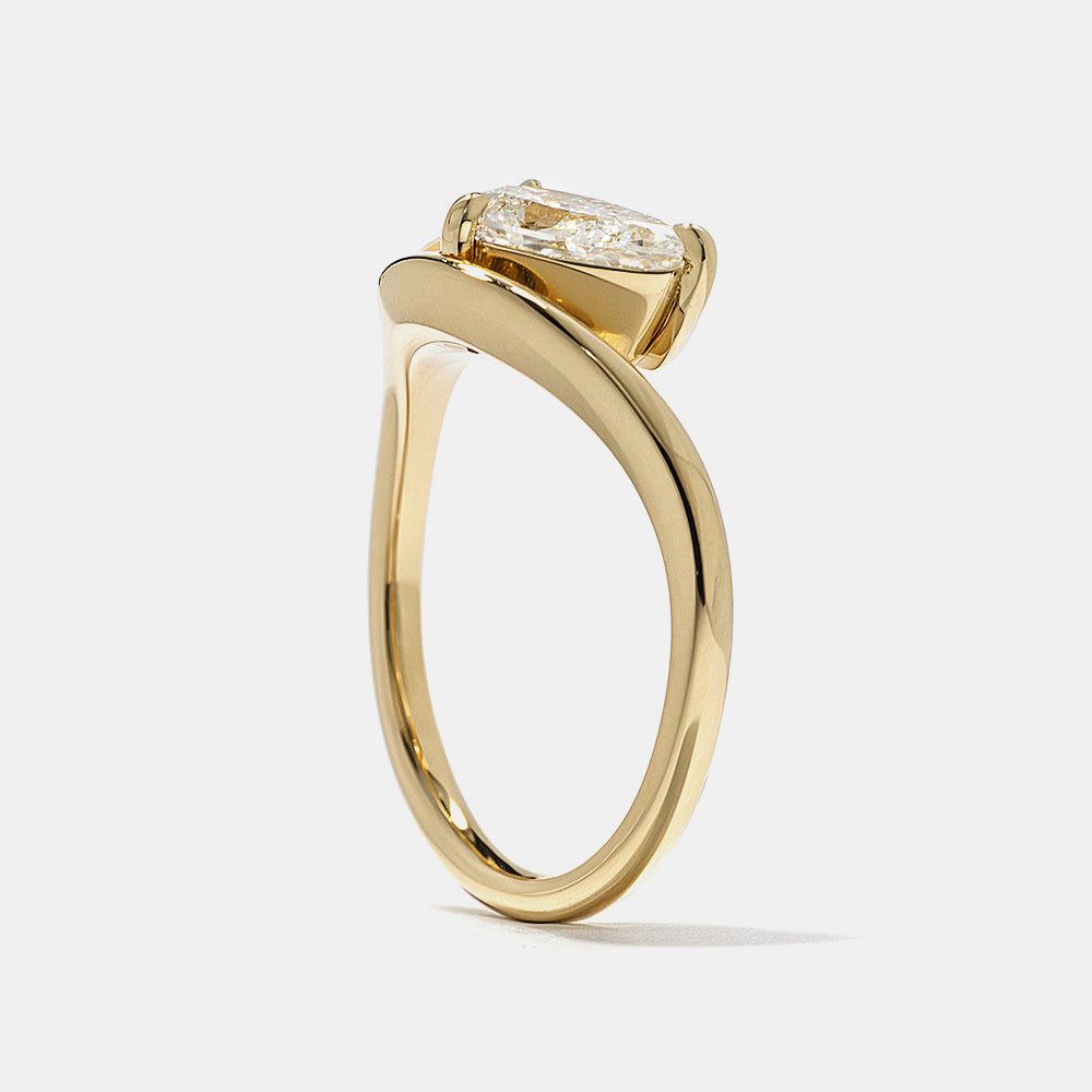 Modern Toi Et Moi engagement ring featuring pear and oval lab grown diamonds in secure bezel setting