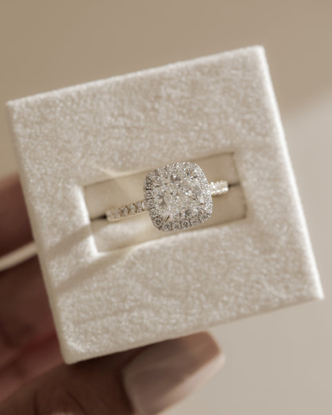 Modern cushion lab diamond halo cathedral pavé engagement ring featuring elevated structure and sparkling pavé band