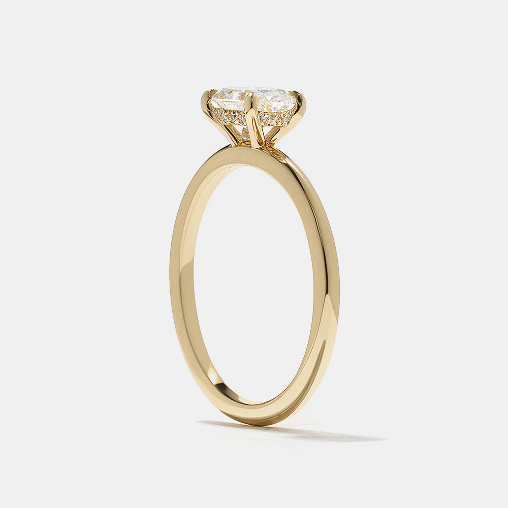Modern east west oval lab grown diamond engagement ring featuring hidden halo detail and minimalist aesthetic design