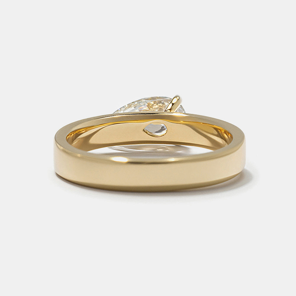 Modern east west pear lab grown diamond cigar band solitaire engagement ring featuring sleek horizontal bold styling