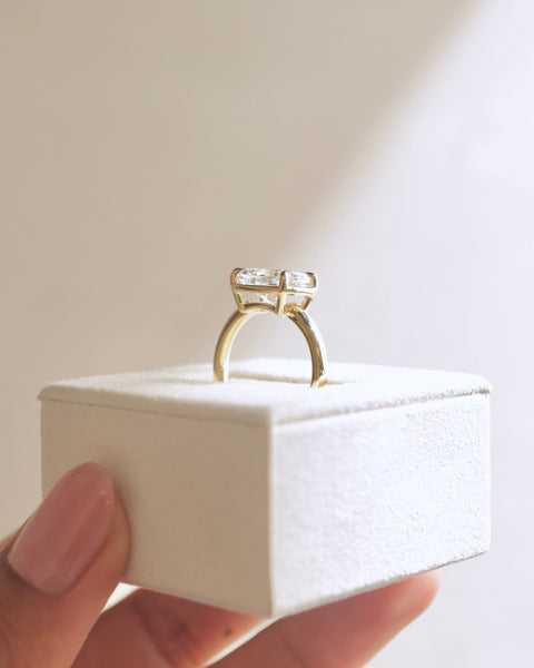 Modern elongated cushion cut lab diamond engagement ring with horizontal layout and sophisticated minimalist design
