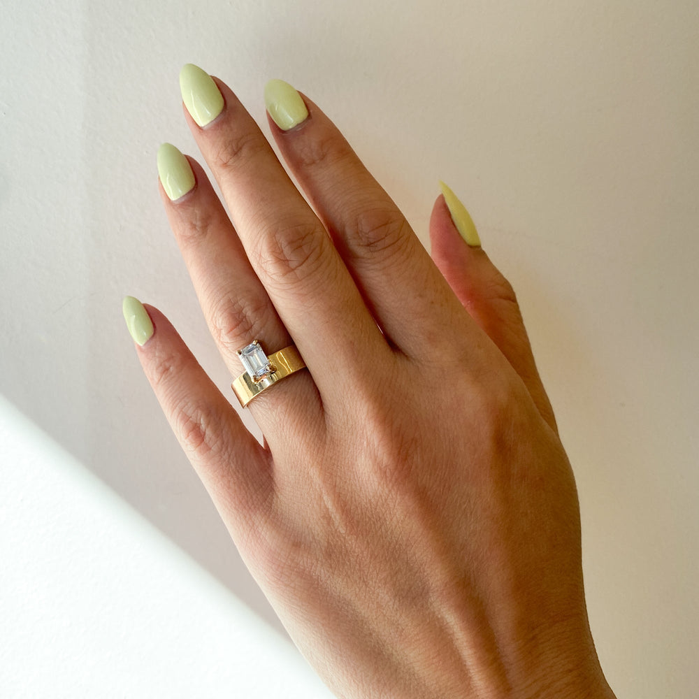 Modern emerald cut lab grown diamond monolith engagement ring featuring clean geometric architectural styling