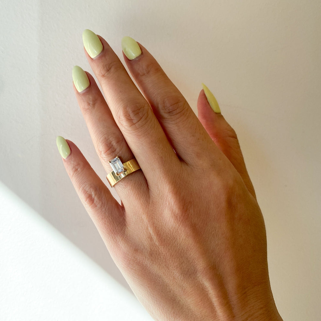 Modern emerald cut lab grown diamond monolith engagement ring featuring clean geometric architectural styling