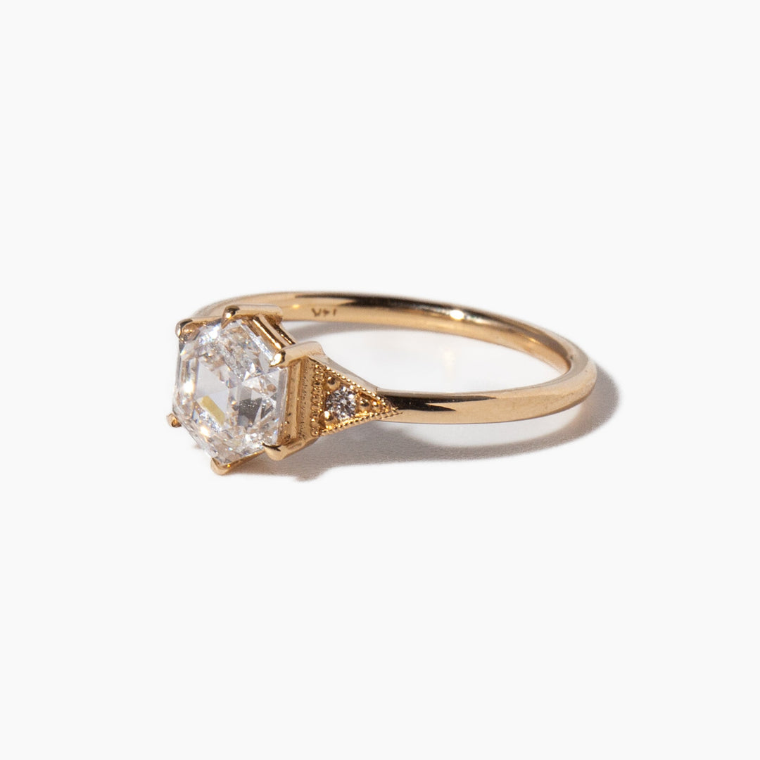 Modern hexagon cut lab grown diamond engagement ring featuring geometric art deco structure and clean lines