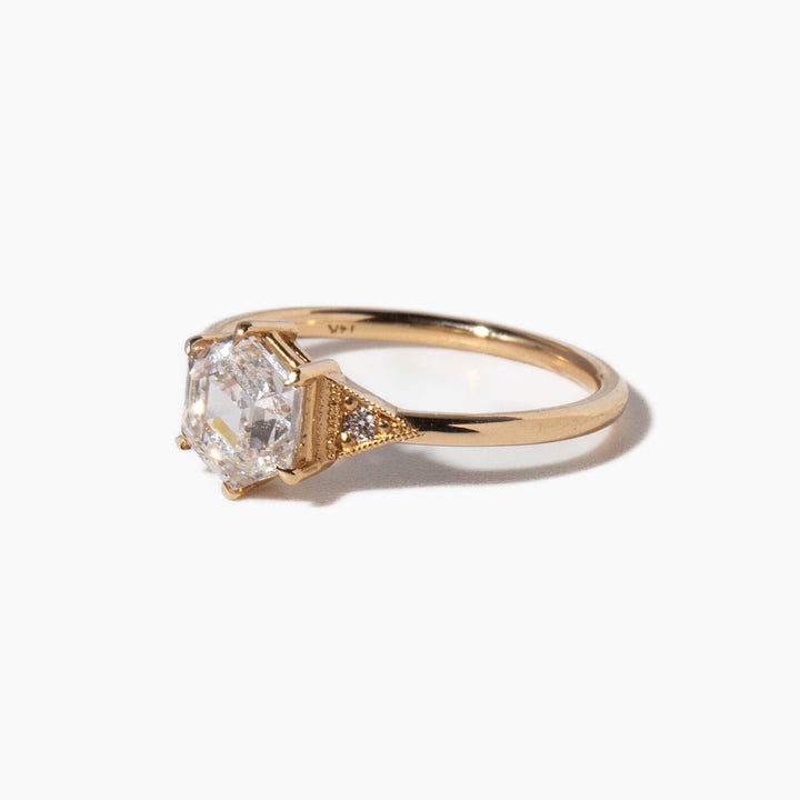 Modern hexagon cut lab grown diamond engagement ring featuring geometric art deco structure and clean lines