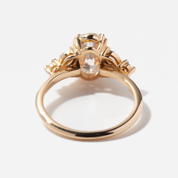Modern oval cut lab grown diamond cluster engagement ring featuring balanced halo inspired multi-stone layout