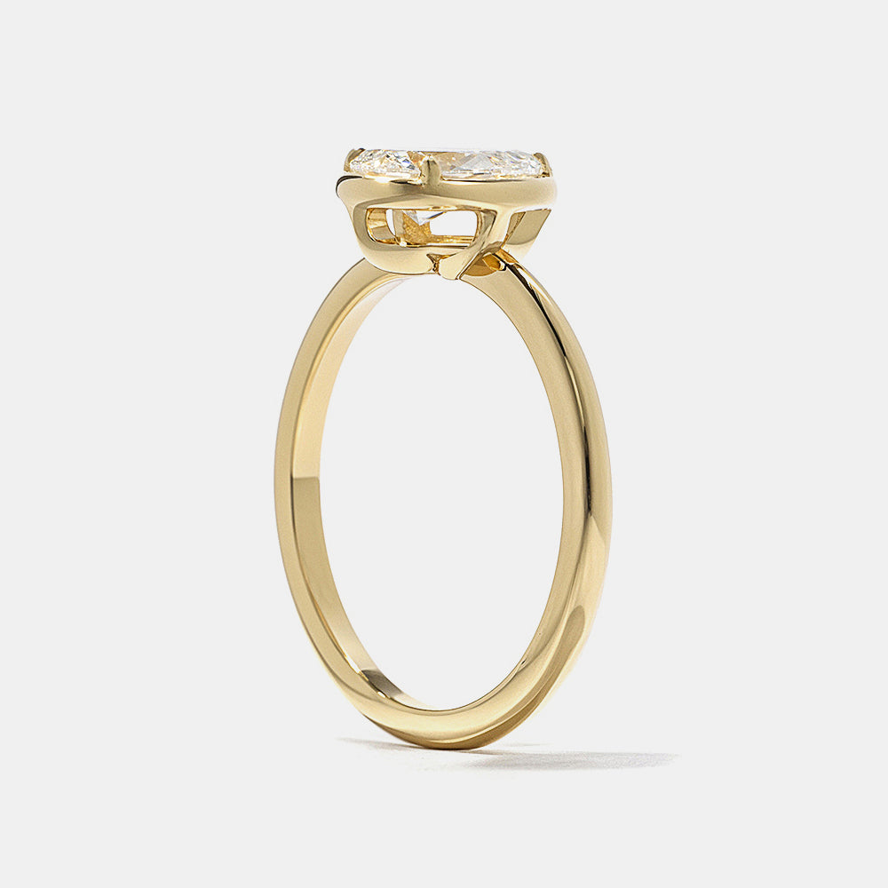 Modern pear cut lab grown diamond bezel solitaire engagement ring designed for sleek minimalist bridal jewelry style