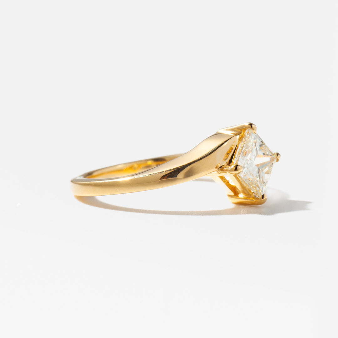 Modern princess cut lab grown diamond solitaire engagement ring set on a polished gold band