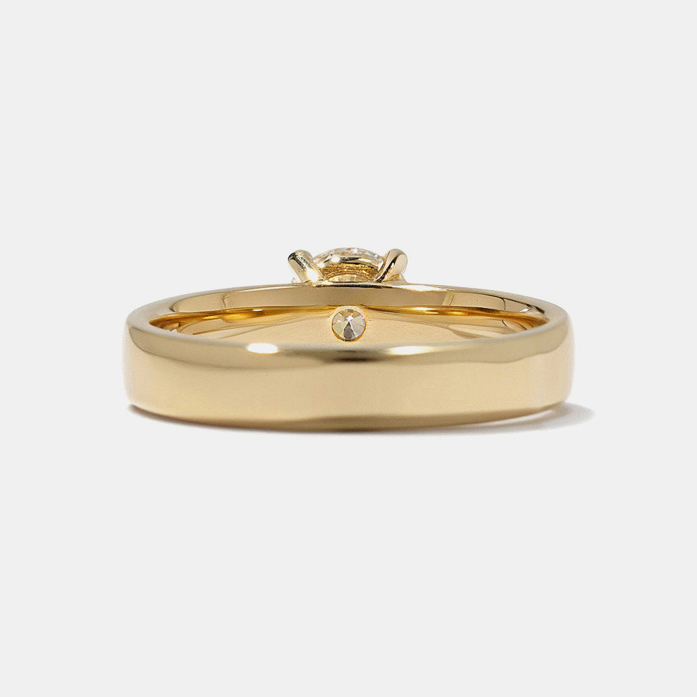 Modern round lab grown diamond cigar band solitaire engagement ring featuring clean bold architectural styling