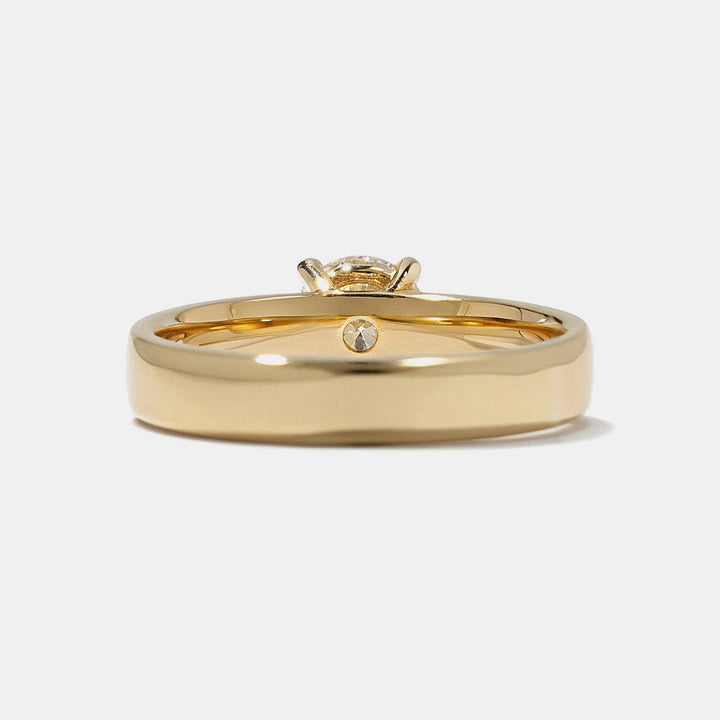Modern round lab grown diamond cigar band solitaire engagement ring featuring clean bold architectural styling