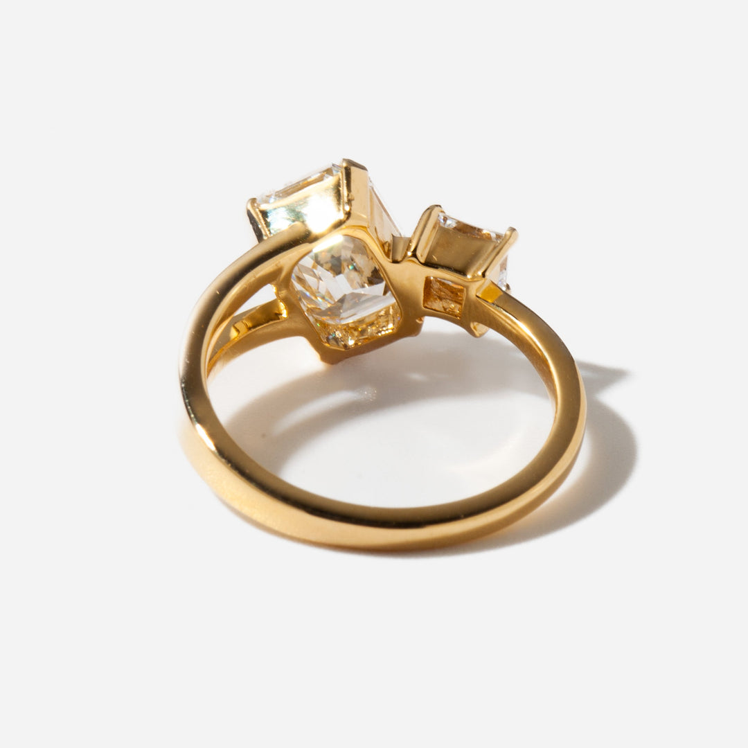 Modern Toi Et Moi engagement ring featuring emerald and princess cut lab grown diamonds in balanced dual stone layout