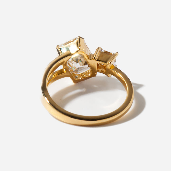 Modern Toi Et Moi engagement ring featuring emerald and princess cut lab grown diamonds in balanced dual stone layout