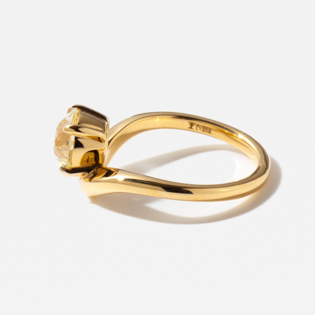 Side profile of a 1.5 carat old European cut lab diamond engagement ring showing antique curved band structure