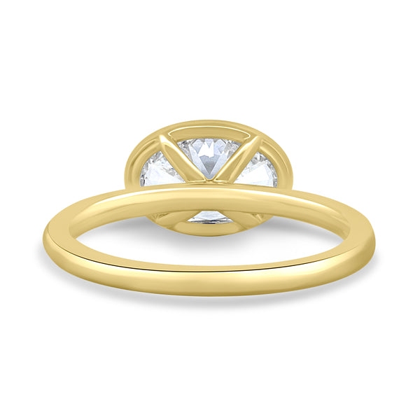 Close-up of oval lab grown diamond east west engagement ring showcasing secure bezel setting and horizontal orientation