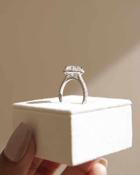 oval cut halo cathedral engagement ring with pavé band USA