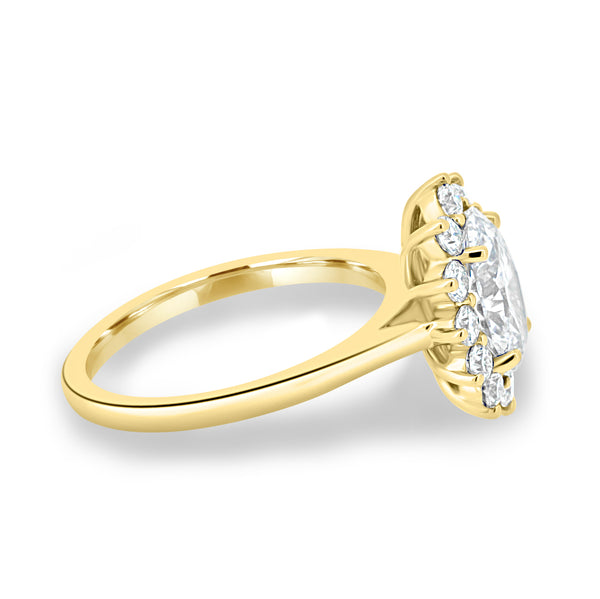 Side profile of oval cut lab diamond halo cathedral engagement ring highlighting elevated prong setting and structure