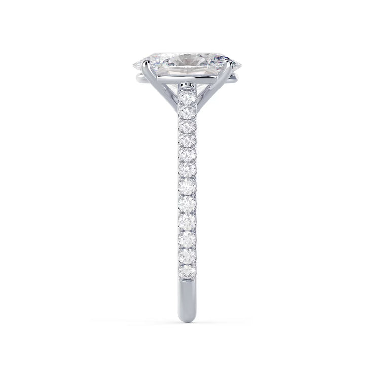 Side profile of an oval cut lab grown diamond cathedral pave engagement ring showing elevated cathedral setting design