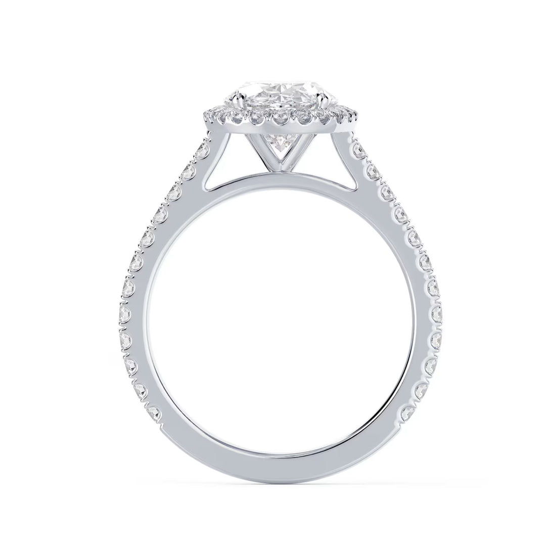 Close-up of an oval cut lab grown diamond halo cathedral pave engagement ring highlighting elongated brilliance and pavé detailing