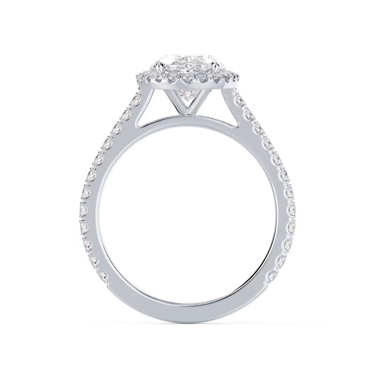 Close-up of an oval cut lab grown diamond halo cathedral pave engagement ring highlighting elongated brilliance and pavé detailing