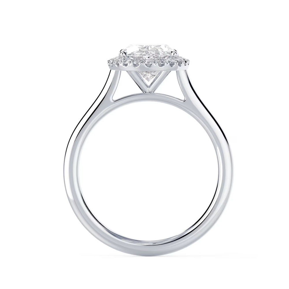 Close-up of an oval cut lab grown diamond halo solitaire engagement ring highlighting elongated brilliance and halo framing