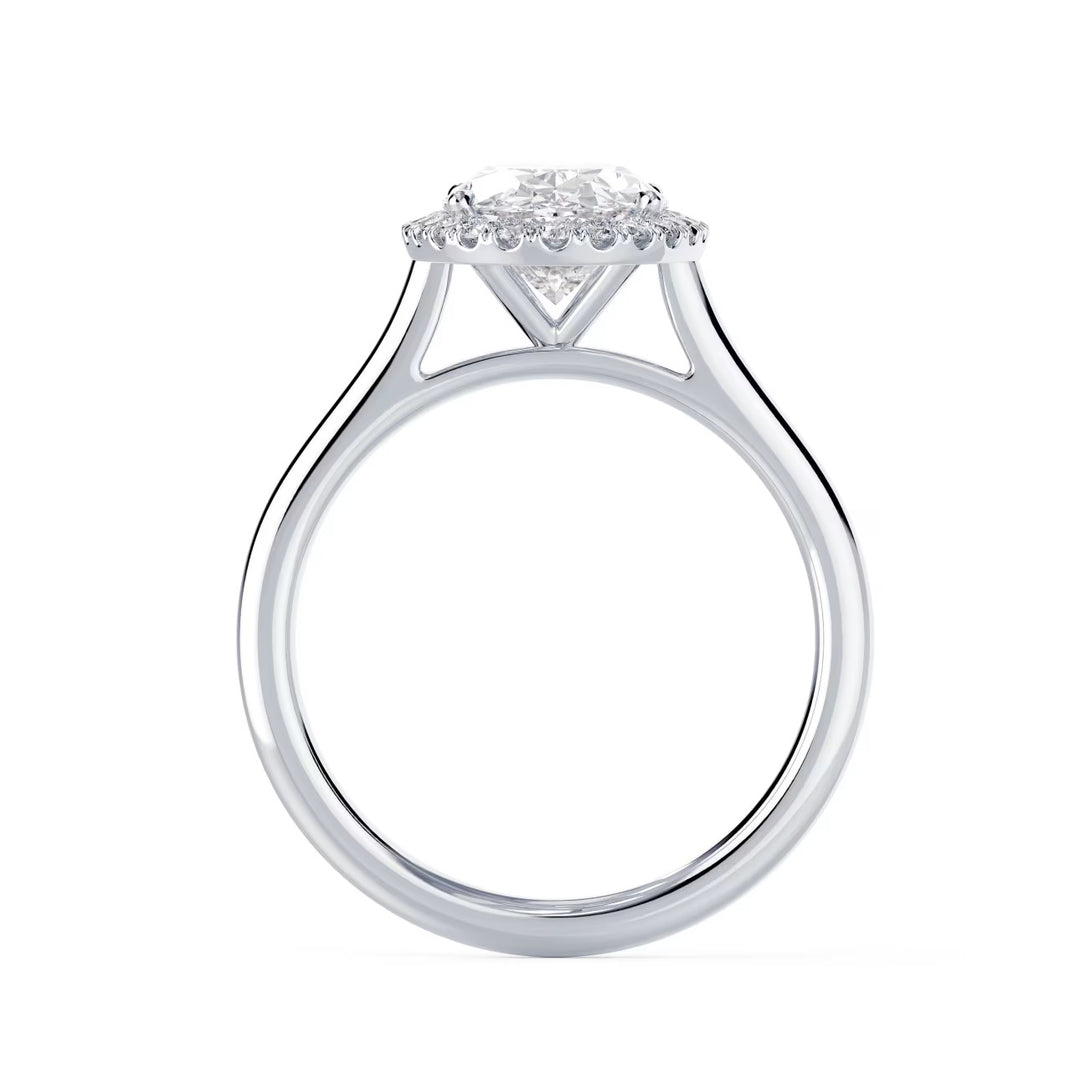 Close-up of an oval cut lab grown diamond halo solitaire engagement ring highlighting elongated brilliance and halo framing
