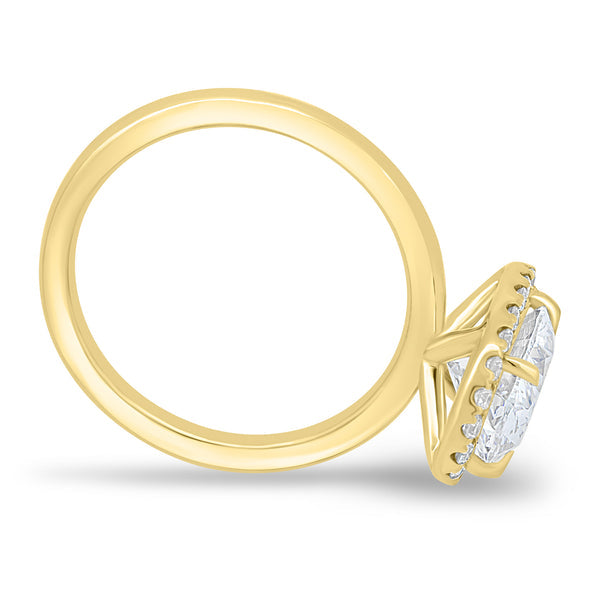 Oval cut lab grown diamond halo engagement ring featuring a sparkling halo frame and classic solitaire presentation