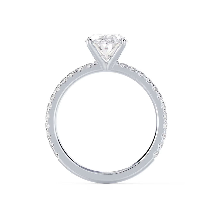 Close-up of an oval cut lab diamond pave engagement ring highlighting elongated brilliance and pavé band sparkle