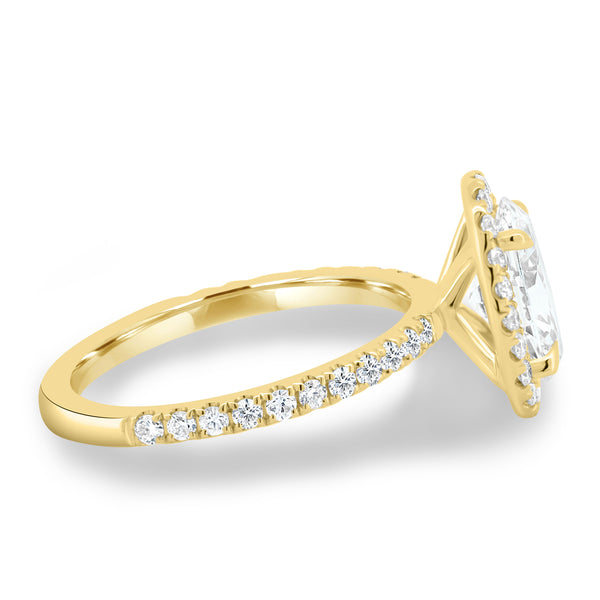 Side profile of oval lab diamond halo pavé engagement ring showing delicate pavé band and elevated center stone