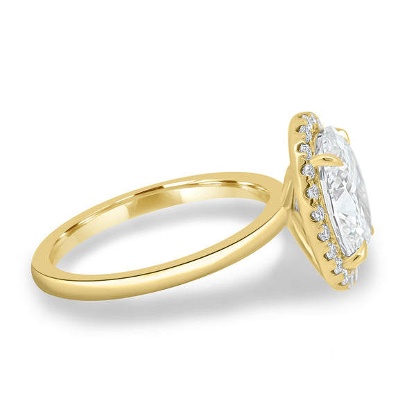 Side profile of oval lab diamond halo solitaire engagement ring highlighting elevated center stone and refined setting