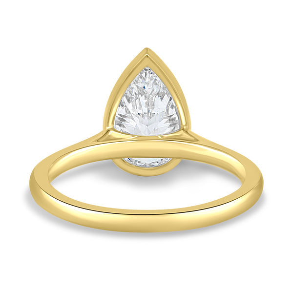 Close-up of pear cut lab grown diamond cathedral engagement ring highlighting the secure bezel setting and teardrop shape