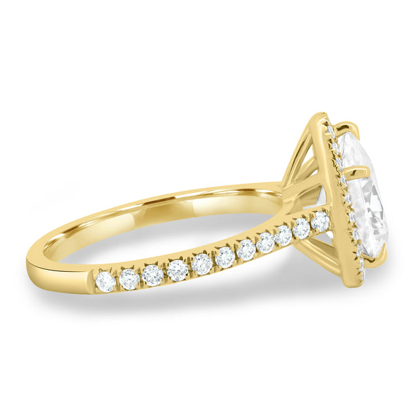 Side profile of pear lab diamond halo cathedral pavé engagement ring showing elevated cathedral arches and refined structure