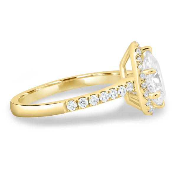 Side profile of pear lab diamond halo pavé engagement ring highlighting elegant setting and delicate pavé band